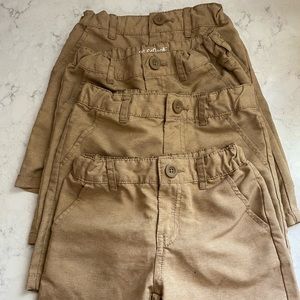 Four pair Cat and Jack size 5t khaki uniform shorts